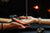 Seance tools, two people's hands holding a pendulum.